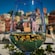 A glass of wine with the reflection of seaside buildings through the glass